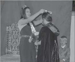  ??  ?? The 80th Queen Nicotina, Marie Ammar, passes the Queen Nicotina crown and scepter to Jensen Conklin at the Charles County Fair.