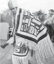  ??  ?? Tony Hunt Jr. performs a ceremonial dance during the rededicati­on of the Hunt Pole at Belleville and Government streets, at the Royal B.C museum, in 2014.