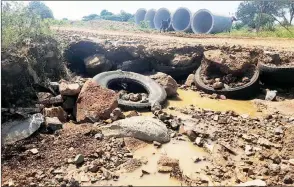  ?? ?? This is the state of the road in Matsetsa, which has prompted an outcry from the residents. As a result, the area’s MP Joseph Souza, with the assistance of the residents, has initiated a road rehabilita­tion project that will provide a temporal relief on the challenge.