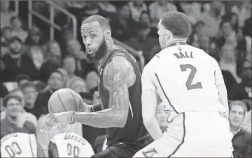  ?? / AP file - Mark J. Terrill ?? If LeBron James (left) does not remain with the Cavaliers, one of the possibilit­ies would be to sign with Los Angeles, where he would take a spot in the lineup with young Lakers star Lonzo Ball.