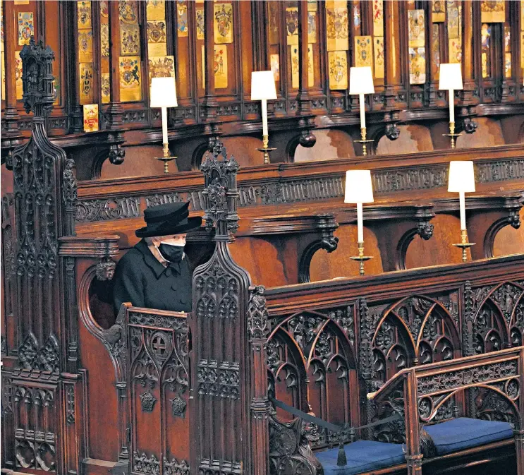  ??  ?? Queen Elizabeth II takes her seat for the funeral of the Duke of Edinburgh in St George’s Chapel, Windsor (above); she had arrived in the Royal Bentley (below)