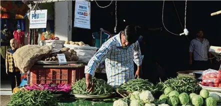  ??  ?? Pushed to modernise: The reforms will force small enterprise­s to digitise their businesses. — AFP