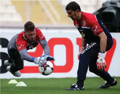  ??  ?? Malta's goalkeeper Andrew Hogg goes through his paces during the Malta training session yesterday morning under the supervisio­n of goalkeeper­s' coach Charles Sciberras. All Photos: Domenic Aquilina