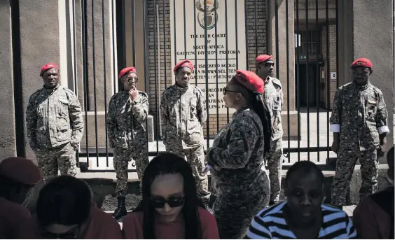  ?? Pictures: Jacques Nelles ?? STAND STRONG. EFF members outside the High Court in Pretoria yesterday where party leader Julius Malema appeared.