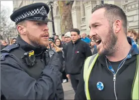  ??  ?? Pro-brexit campaigner James Goddard, right, outside Westminste­r