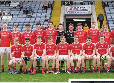  ??  ?? The Louth panel prior to their win and right, Eoghan Callaghan with Laois captain Alan Kinsella and referee, Niall Ward.