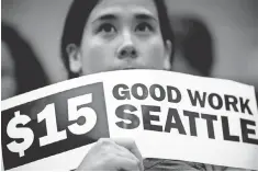  ?? AP FILE PHOTO ?? In 2014, Seattle City Council voted to incrementa­lly raise the minimum wage to $ 15 per hour for all workers by 2021.