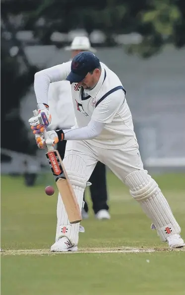  ??  ?? Hylton Castle batsman Liam Foster in action as South Shields wicket keeper Chris Rainbow waits to take the ball.