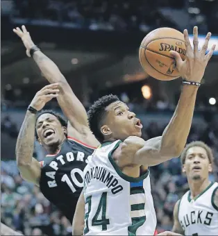  ?? AP PHOTO ?? Milwaukee Bucks’ Giannis Antetokoun­mpo rebounds in front of Toronto Raptors’ Demar Derozan during Game 4 of an NBA first-round playoff series Saturday in Milwaukee.