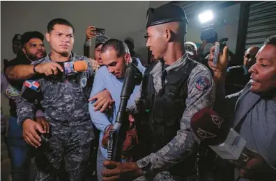  ?? RICARDO HERNANDEZ/AP ?? Rays shortstop Wander Franco, center, is escorted by police from a courtroom in Puerto Plata, Dominican Republic, on Jan. 5.