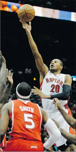  ??  ?? Toronto Raptors guard Leandro Barbosa shoots past Atlanta Hawks forward Josh Smith and guard Joe Johnson.
