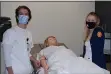  ?? SHEA SINGLEY — MEDIANEWS GROUP ?? Alvernia University nursing students Joseph Iannozzi and Jessica Visbisky examine one of the mannequin patients in a classroom in the nursing resource center on campus.