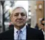  ?? THE ASSOCIATED PRESS ?? Former Penn State president Graham Spanier walks to the Dauphin County Courthouse in Harrisburg, Pa., Monday.