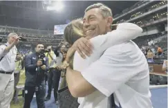  ??  ?? 0 Pedro Caixinha hugs his wife after Cruz Azul’s Copa MX win.