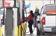  ?? Jerry Lara / San Antonio Express-News ?? A woman buys gasoline at a QuikTrip gas station in San Antonio, Texas, on Thursday.