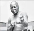  ?? ASSOCIATED PRESS FILE PHOTO ?? Boxer Jack Johnson, the first black world heavyweigh­t champion, poses in 1932 in New York City. President Donald Trump on Thursday granted a posthumous pardon, clearing Johnson’s name more than 100 years after a racially charged conviction.