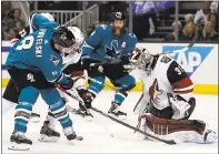  ?? PHOTO BY TONY AVELAR — ASSOCIATED PRESS ?? The Coyotes’ Scott Wedgewood (31) stops the Sharks’ Joe Pavelski. Pavelski scored one of three Sharks goals in the first.