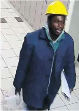  ?? TORONTO POLICE SERVICE ?? Samuel Opoku is seen on a security camera carrying a bucket and a clipboard through a hallway.