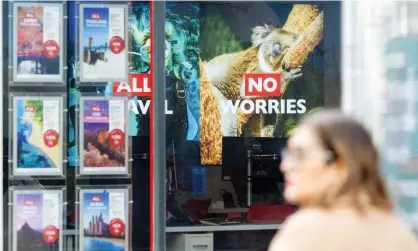  ?? Photograph: Akira Suemori/REX/Shuttersto­ck ?? Posters in a travel agent’s window in London. ‘People rushed to bet on the possibilit­y of taking a foreign holiday in July or August’.