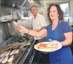  ?? FM4044437 ?? Chef Keith Beadle and Julie Breen back in action in the kitchen