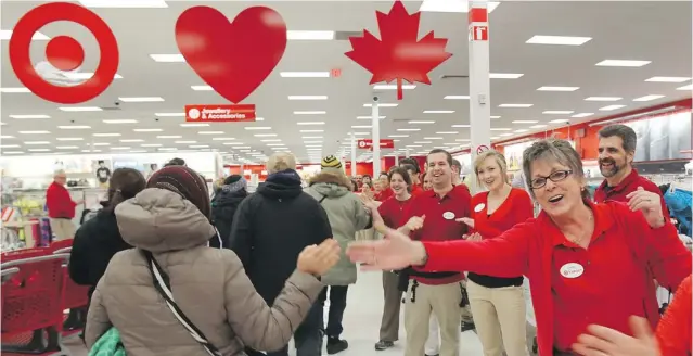  ?? DAVE CHIDLEY / THE CANADIAN PRESS ?? Canadians have welcomed giant American discount retailers such as Target in hopes of taking advantage of lower U. S. prices.