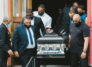  ?? GABRIELA BHASKAR/THE NEW YORK TIMES ?? The coffin bearing the remains of Heyward Patterson, who was killed on May 14 in the racist shooting at a Tops Friendly Market, is carried from the Lincoln Memorial United Methodist Church in Buffalo, New York, on Friday. Patterson, a 67-year-old church deacon whose life revolved around service and faith, was the first of 10 massacre victims to be laid to rest.