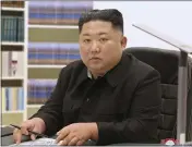  ?? KOREAN CENTRAL NEWS AGENCY — KOREA NEWS SERVICE ?? North Korean leader Kim Jong Un writes his New Year’s card to the public.