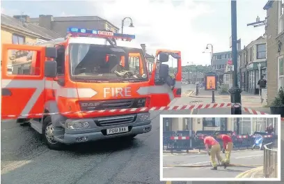  ??  ?? A fire engine blocks off Abbey Street after the explosion while firefighte­rs (inset) check out the manhole cover