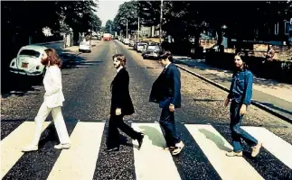  ?? HANDOUT ?? The Beatles’ famous Abbey Road shot from 1969.