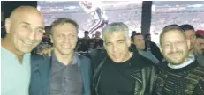  ?? (Yesh Atid) ?? YESH ATID chairman Yair Lapid (second right) and then-MK Dov Lipman (right) attend the party’s Super Bowl get-together last year.