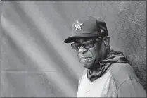  ?? [JEFF ROBERSON/THE ASSOCIATED PRESS] ?? Houston Astros manager Dusty Baker leans against a fence during spring training practice Thursday in West Palm Beach, Fla.