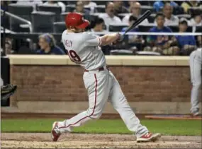  ?? BILL KOSTROUN — THE ASSOCIATED PRESS ?? Who’s that hot hitter? None other than Phillies rookie starting pitcher Ben Lively, cracking a two-run single during the second inning Tuesday night at Citi Field.