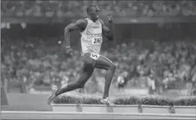  ?? RICHARD LAUTENS, TORONTO STAR ?? Usain Bolt is willing to give up that relay gold medal, if the IOC can catch him.