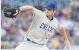  ?? AFP ?? The Cubs’ Cole Hamels pitches in the first inning against the Pirates at PNC Park.