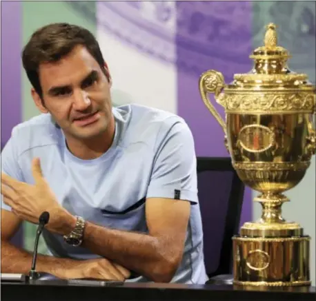  ?? ADAM DAVY/PA VIA AP ?? Roger Federer’s eighth Wimbledon title pushed him back up to No. 3 in the ATP rankings.