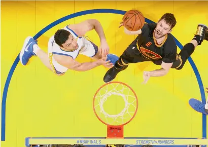  ?? AFP ?? Kevin Love (right) of the Cleveland Cavaliers goes to the basket against the Golden State Warriors in Game Two of the 2017 NBA Finals at the Oracle Arena in Oakland, California. —