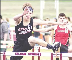  ?? Staff photograph by Randy Moll ?? Junior Blackhawk Kenny Dorsey took first place in the 300-meter hurdles in the Panther Relays in Siloam Springs with a time of 43.59.