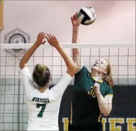  ?? RANDY MEYERS — THE MORNING JOURNAL ?? Tory Small of Amherst taps the ball over Sylvie Yappel of Westlake for point during the second set.