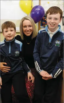  ?? Photo by Michelle Cooper Galvin ?? Joanne O’Sullivan with her sons, Ruairi and Diarmuid, at the opening of the 2020 Vision Project Capsule at Knockaderr­y Farranfore NS on Friday.