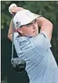  ?? Rob Carr Getty Images ?? RICKIE FOWLER prepares for the U.S. Open.