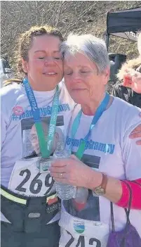  ??  ?? Dot Jones and daughter Lowri at the finish line
