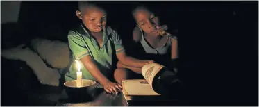  ?? Picture: Reuters ?? Township families and businesses, with little cash for alternativ­e power, suffer worst during rolling blackouts.