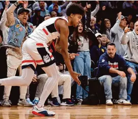  ?? Sarah Stier/Getty Images ?? UConn’s Jaylin Stewart reacts after scoring in the second half against Marquette during the Big East champinshi­p game Saturday at Madison Square Garden.