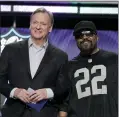  ?? JOHN LOCHER — THE ASSOCIATED PRESS ?? Rapper Ice Cube, right, poses with NFL Commission­er Roger Goodell during the first round of the NFL Draft on April 28 in Las Vegas.