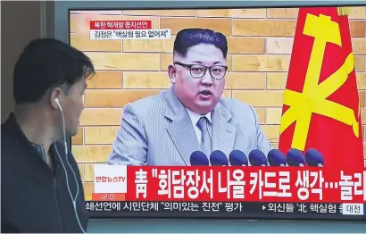  ?? Picture: AFP ?? INTEREST. A man watches television news showing file footage of North Korean leader Kim Jong Un, at a railway station in Seoul on Saturday.