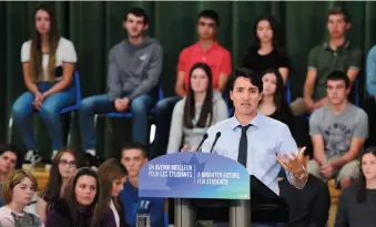  ?? CP PHOTO ?? Prime Minister Justin Trudeau speaks to students at Ecole Secondaire Catholique Cite des Jeunes in Kapuskasin­g, Ont., on Wednesday.