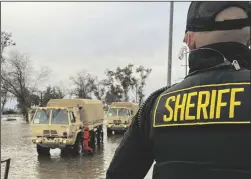 ?? COURTESY PHOTOGRAPH ?? Emergency responders helped evacuate residents from a flooded mobile home park in Acampo on Jan. 15.