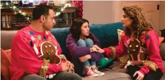  ?? DISNEY CHANNEL ?? Co-starring with Scarlett Estevez (center) in “Christmas Again” are Chicago native Daniel Sunjata (“Rescue Me”) and Alexis Carra as the girl’s divorcing parents.