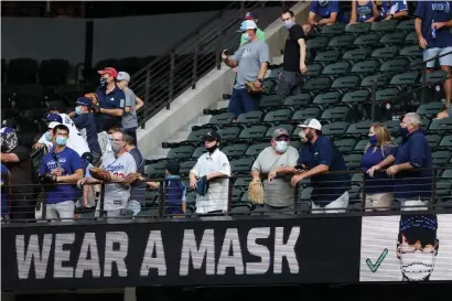  ?? Getty IMaGes Photos ?? A LITTLE DIFFERENT THIS YEAR: With limited capacity and reminders of the coronaviru­s pandemic, the Fall Classic doesn’t feel the same as it once did.