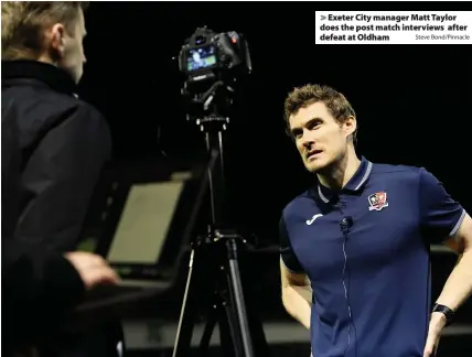  ?? Steve Bond/Pinnacle ?? > Exeter City manager Matt Taylor does the post match interviews after defeat at Oldham